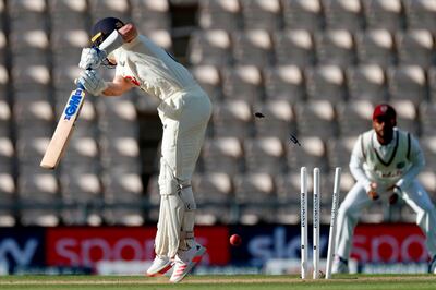 England's Ollie Pope is bowled by West Indies' Shannon Gabriel on the fourth day of the first Test cricket match between England and the West Indies at the Ageas Bowl in Southampton, southwest England on July 11, 2020.   - RESTRICTED TO EDITORIAL USE. NO ASSOCIATION WITH DIRECT COMPETITOR OF SPONSOR, PARTNER, OR SUPPLIER OF THE ECB
 / AFP / POOL / Adrian DENNIS / RESTRICTED TO EDITORIAL USE. NO ASSOCIATION WITH DIRECT COMPETITOR OF SPONSOR, PARTNER, OR SUPPLIER OF THE ECB
