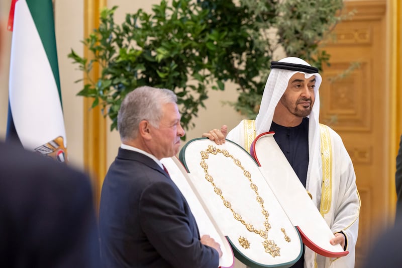 Sheikh Mohamed presents a Zayed Medal to King Abdullah. Ryan Carter / UAE Presidential Court