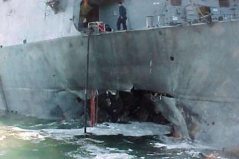 The port side of the guided missile destroyer, USS Cole, is pictured after a bomb attack during a refuelling operation in the port of Aden in October, 2000.