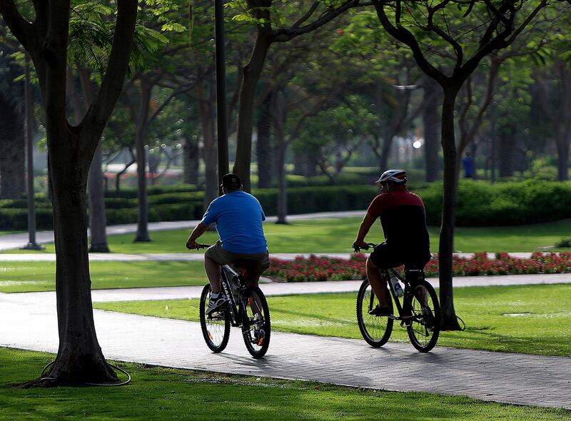 Dubai, United Arab Emirates-May,05,2016: People Cycling  in Al Barsha Pond Park in Dubai . ( Satish Kumar / The National  ) 
ID No: 80332
Section: News *** Local Caption ***  SK-PondPark-05052016-09.jpg