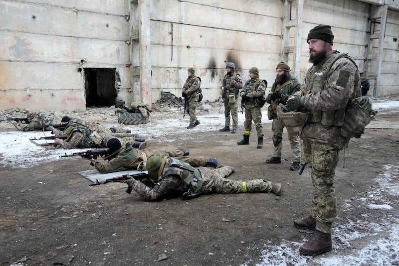 Belarusian volunteers take part in military exercises at the Belarusian Company base in Kyiv. AP