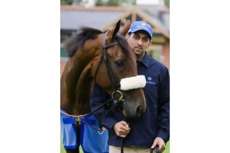 Godophin trainer Mahmood Al Zarooni with Rewilding at the Moulton Paddocks in Newmarket, UK.