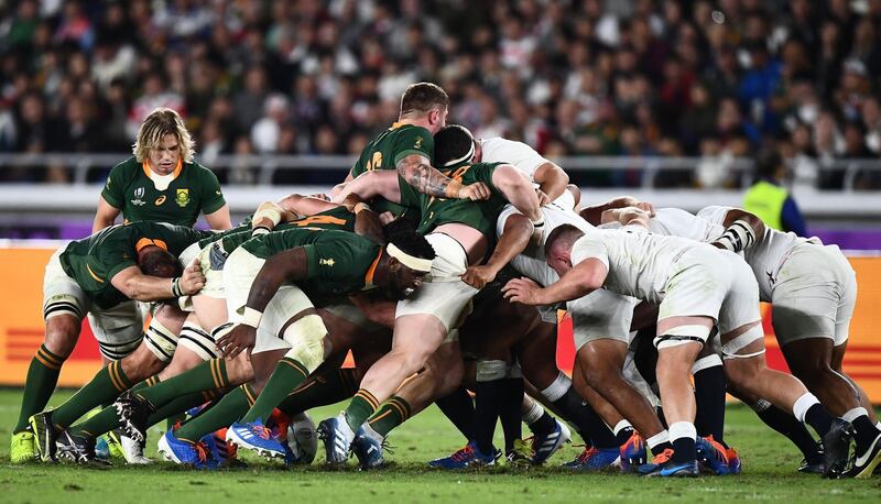 South Africa and England players compete in the scrum. AFP