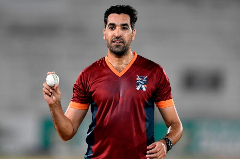 Pakistani cricketer Umar Gul holds a ball before the start of his final match in Rawalpindi on October 16, 2020. AFP