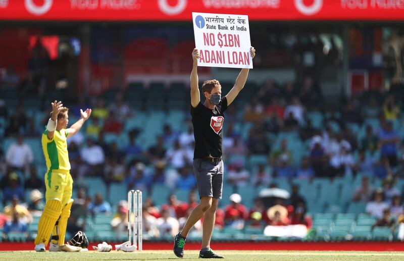 A protester walks onto the pitch during the first ODI between Australia and India at the Sydney Cricket Ground. Getty