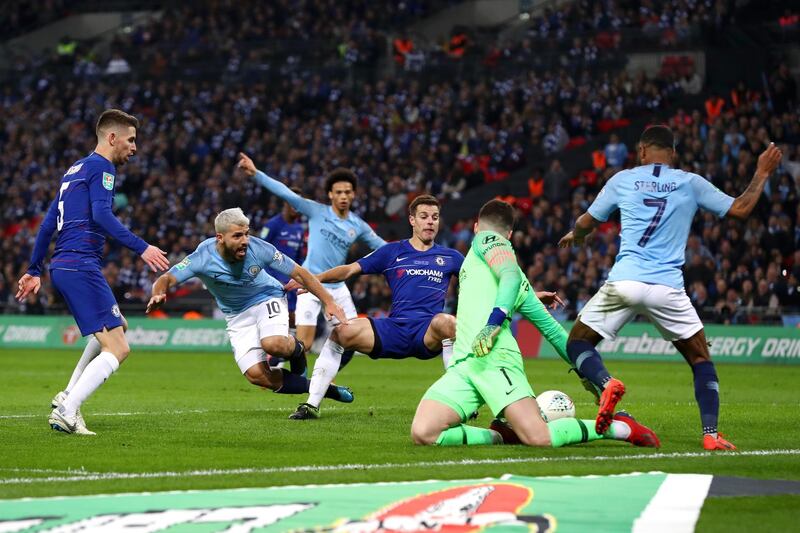 Aguero shoots under pressure from Cesar Azpilicueta of Chelsea. Getty Images