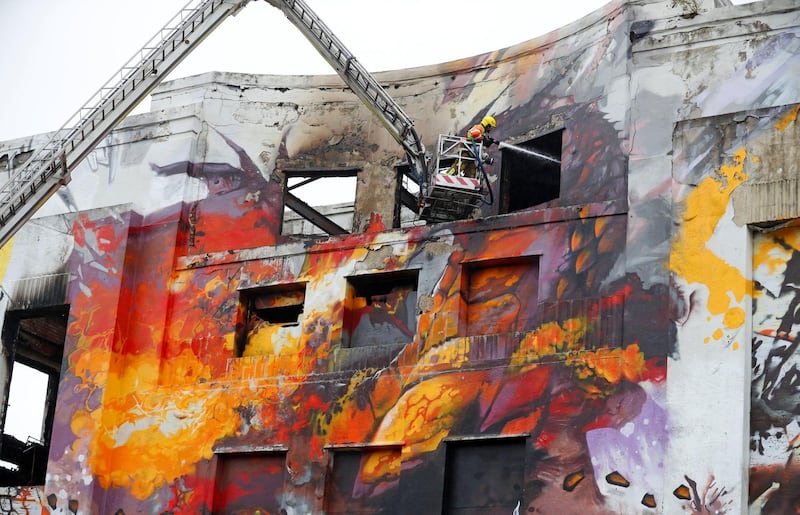 Firefighters continue to tackle a fire at the Littlewoods Pools building in Liverpool, Britain. Phil Noble / Reuters