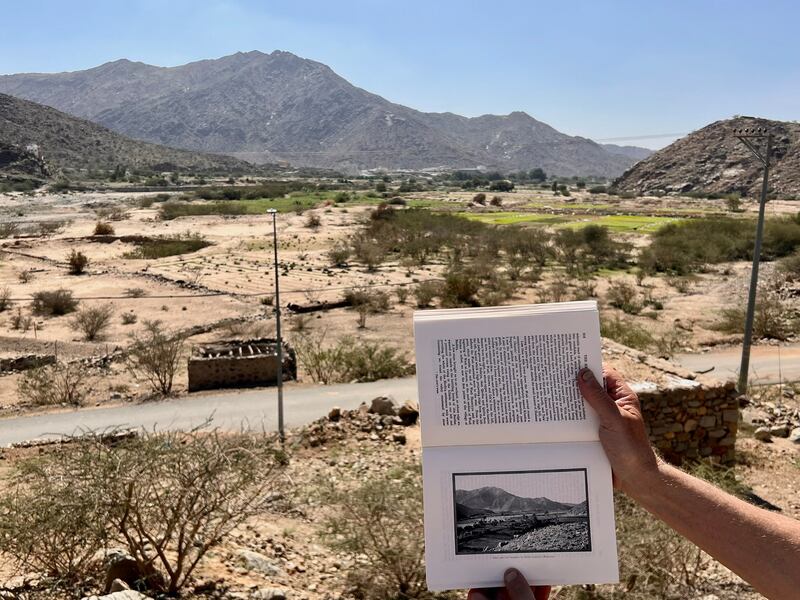Mark Evans shows a photograph taken by Philby and published in his book The Heart of Arabia. Mr Evans was standing in the same spot, in the valley of lemons, which Philby said was one of the most beautiful places on his trip