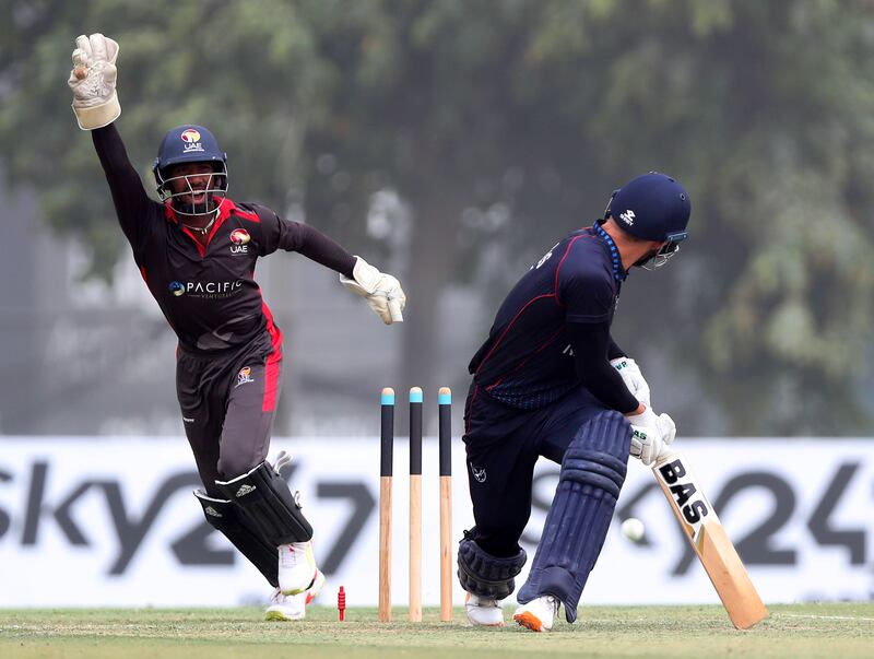 Namibia captain Gerhard Erasmus is bowled by UAE's Ahmed Raza for 10.