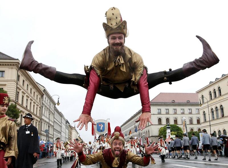 Actors perform during the Oktoberfest parade in Munich, Germany. Michaela Rehle / Reuters