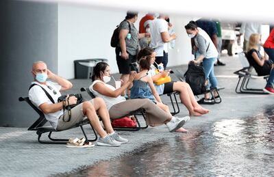 Visitors cool down at the Brazil pavilion at Expo 2020 Dubai. Pawan Singh / The National. 