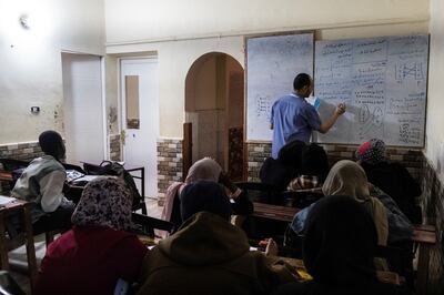 Ihab Abdelwahab, director of the Sudanese School of Dreams for Elementary, Intermediate, and Secondary Education, teaches students in Cairo. Reuters