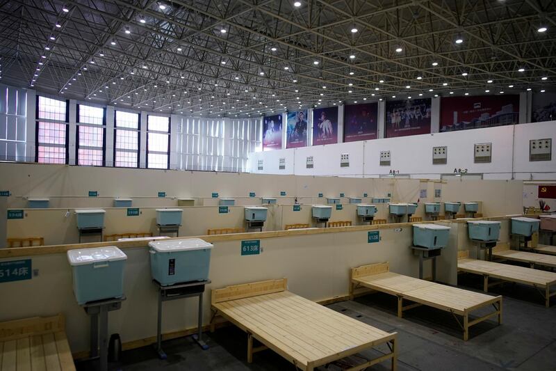 Bed frames are seen inside a convention centre that was used as a temporary hospital in Wuhan. Reuters