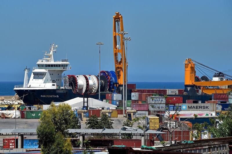 epa09171244 The Amoenitas ship at the Beirut port in Beirut, Lebanon, 01 May 2021. An Amoenitas ship prepares to ferry dozens of containers of hazardous materials from the Lebanese capital to Germany after the eight months of the explosion at Beirut port on 04 August 2020. At least 200 people were killed, and more than six thousand injured in the Beirut blast that devastated the port area on 04 August. It is believed to have been caused by an estimated 2,750 tons of ammonium nitrate stored in a warehouse.  EPA/WAEL HAMZEH