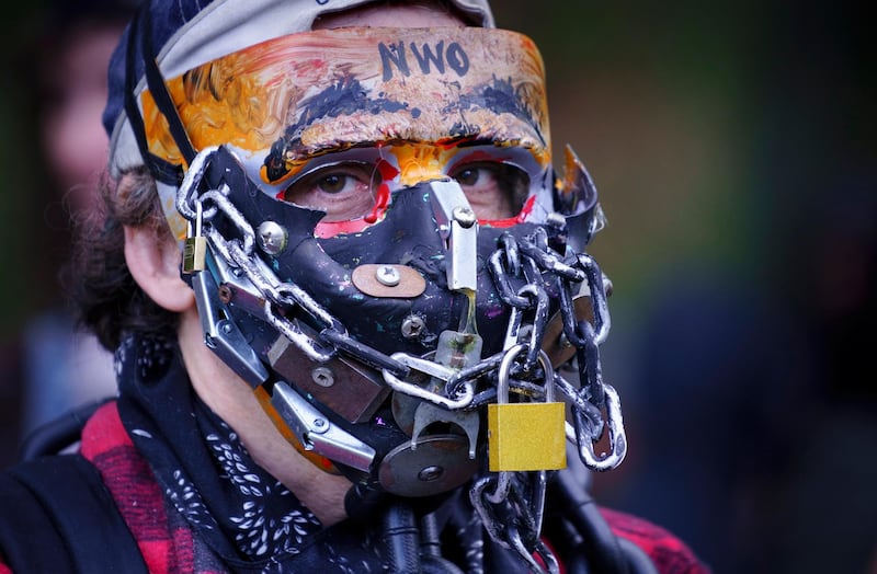 A man takes part in an anti-mask rally in Montreal. The Canadian Press via AP