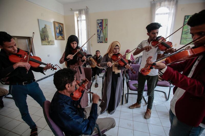 Yemeni students play violins during a music class at the Cultural Centre in Sanaa, Yemen.  Hani Mohammed / AP Photo
