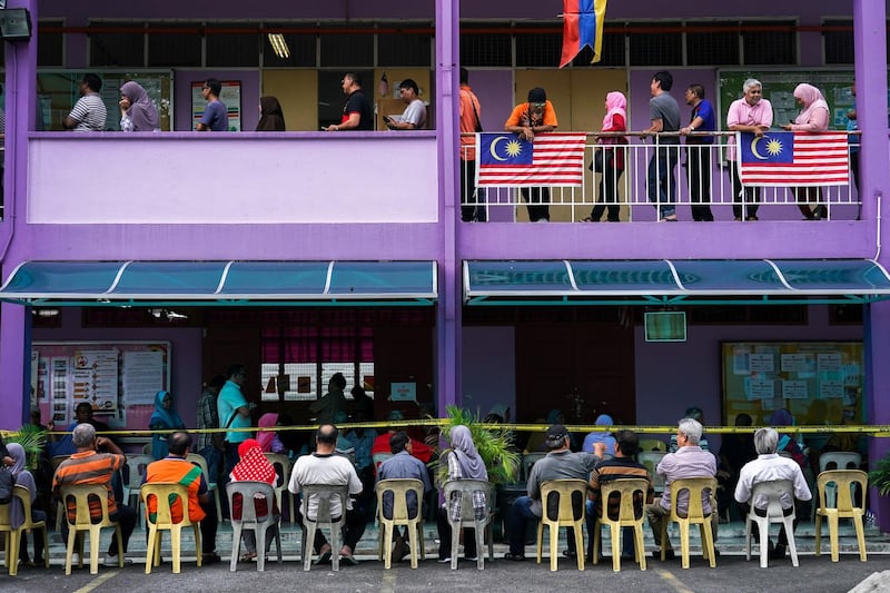 People line up to vote during the general election in Kuala Lumpur, Malaysia. Athit Perawongmetha / Reuters