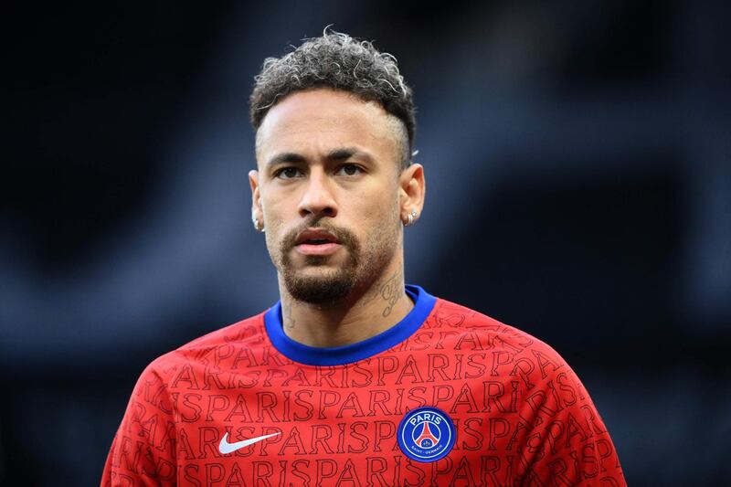 (FILES) In this file photo taken on May 16, 2021 Paris Saint-Germain's Brazilian forward Neymar looks on as he warms up before the French L1 football match between Paris Saint-Germain and Stade de Reims at the Parc des Princes stadium in Paris. Nike said on May 27, 2021 that it parted ways with Neymar last year after the superstar Brazil attacker "refused to cooperate in a good faith" as the company investigated an employee's claim that he sexually assaulted her. The apparel giant said in a statement that its investigation into the alleged 2016 incident -- which was reported to the company in 2018 -- was inconclusive. / AFP / FRANCK FIFE
