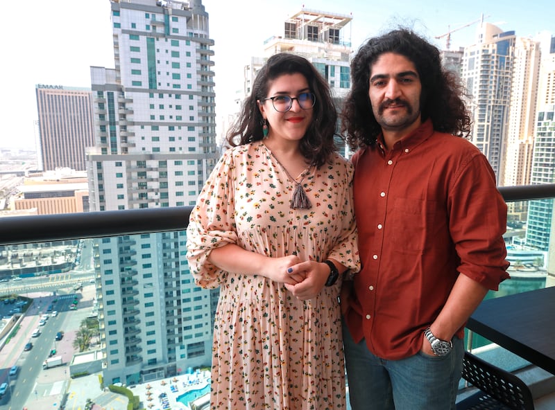Zhale Rousta and her husband Nima Farahbakhsh on the balcony of their apartment in Dubai Marina. All photos: Victor Besa / The National
