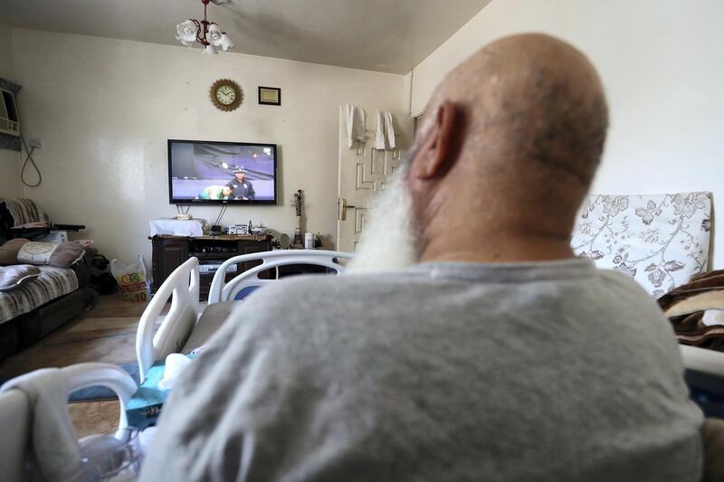 ABU DHABI,  UNITED ARAB EMIRATES , JUNE 17 – 2019 :- Mohammed Ishaq a player in the UAE's 1996 World Cup side, who is now wheelchair bound watching Cricket World Cup at his home in Abu Dhabi. He is on wheelchair since a car crash in 2009. ( Pawan Singh / The National ) For Sport. Story by Paul