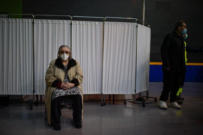 Teresa Cabello, 88, waits in a seat before receiving a Pfizer-BioNTech Covid-19 vaccine in Pamplona, northern Spain. AP Photo