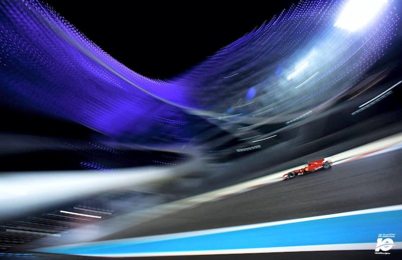 Fernando Alonso drives under the Yas Hotel in 2010. Everyone who follows Formula One is aware of the impressive architectural delight of the Yas Hotel Abu Dhabi. Spanning the twisting and turning street track-like section of the Circuit, the building provides a visual treat for the photographers present.