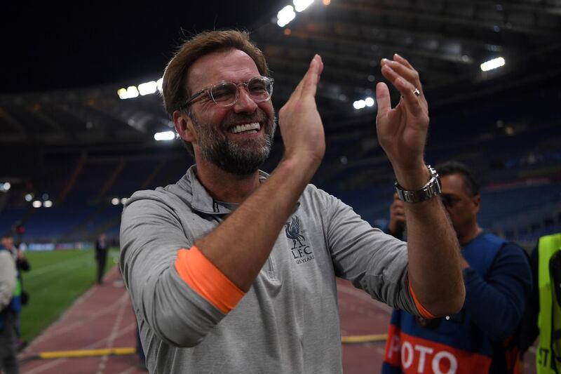 Liverpool manager Jurgen Klopp applauds the fans. Paul Ellis / AFP