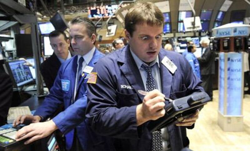 Traders at work on the floor of the New York Stock Exchange at the start of the trading day.