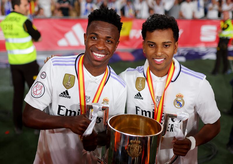 Vinicius Junior and Rodrygo pose with the Copa del Rey trophy after their starring roles for Real Madrid in the final victory over Osasuna. Getty