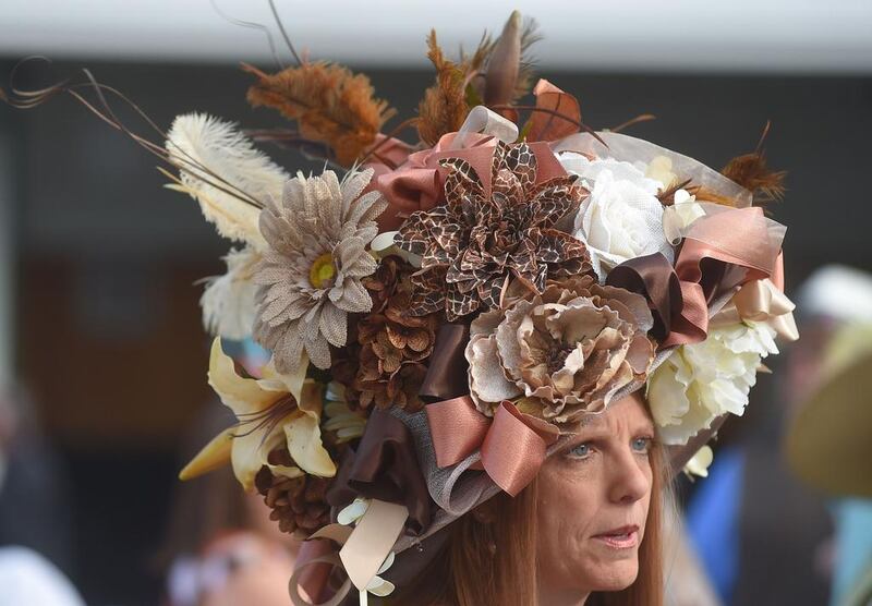 Tami Purcell of Knoxville, Tennessee looks on wearing a festive hat before the 140th running of the Kentucky Derby at Churchill Downs on May 3, 2014 in Louisville, Kentucky. Dylan Buell / Getty Images / AFP