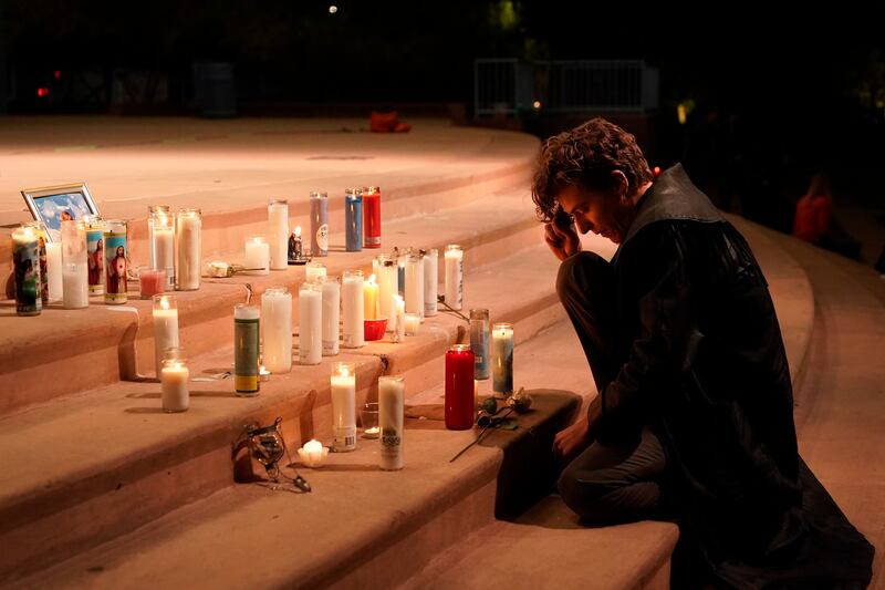 Film industry worker Jake Extine pays his respects. AP