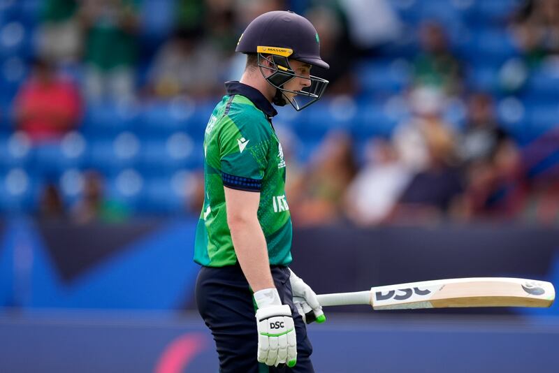Ireland captain Lorcan Tucker leaves the field after losing his wicket to Pakistan's Mohammad Amir for one run. AP 