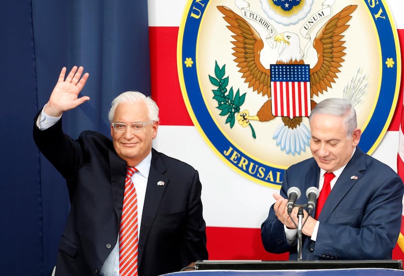 epa06736334 US Ambassador to Israel David Friedman (L) waves as Israeli Prime Minister Minister Benjamin Netanyahu (R) applauds during the opening ceremony at the US consulate that will act as the new US embassy in the Jewish neighborhood of Arnona, in Jerusalem, Israel, 14 May 2018. The US Embassy in Jerusalem is inaugurated on 14 May following its controversial move from Tel Aviv to the existing US consulate building in Jerusalem. US President Trump in December 2017 recognized Jerusalem as Israel's capital. The decision, condemned by Palestinians who claim East Jerusalem as the capital of a future state, prompted worldwide protests and was met with widespread international criticism.  EPA/ABIR SULTAN