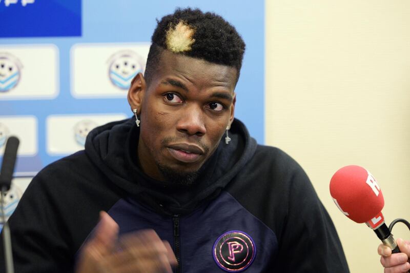 (FILES) In this file photo taken on December 29, 2019 Manchester United and France midfielder Paul Pogba gives a press conference after a  gala football match between All Star France and Guinea at the Vallee du Cher Stadium in Tours, central France. Manchester United star Paul Pogba has promised to financially support the fight to stop the spread of the coronavirus. / AFP / GUILLAUME SOUVANT
