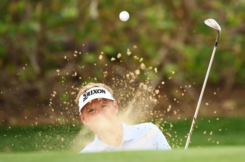 Soren Kjeldsen of Denmark plays his third shot on the first hole. Getty Images