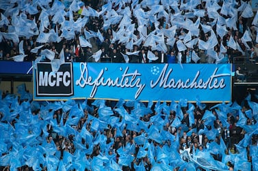 Manchester City fans wave flags and a banner saying Definitely Manchester in similar style to the Oasis album Definitely Maybe before the UEFA Champions League Quarter Final between Manchester City and Tottenham Hotspur at Etihad Stadium on April 17, 2019, Manchester, England. Getty