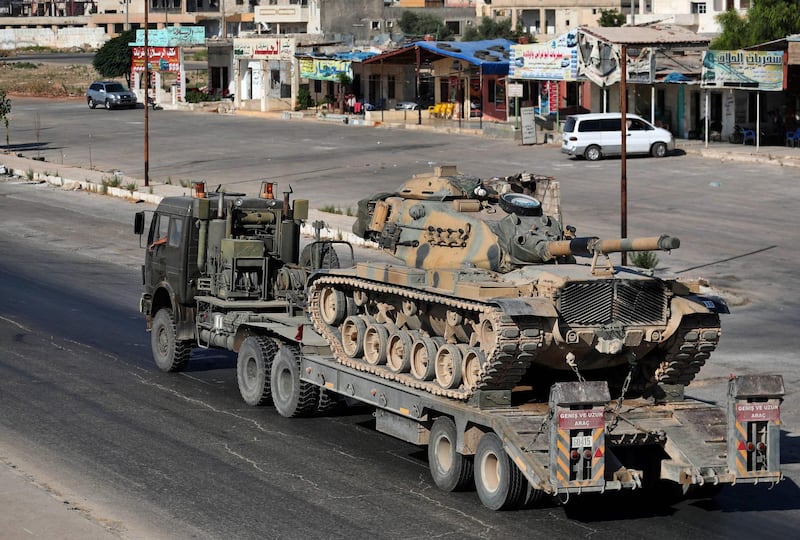 A truck carrying a tank. AFP