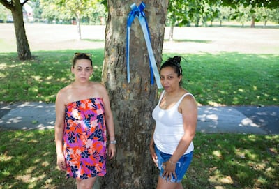 (Flowery dress) - Nichole Young and (white vest and shorts) Yemi Hughes who set up the campaign group Croyden Says No in March 2019 as a result of Yemi's son Andre Aderemi who was murdered 16/8/19. Photographed for the National newspaper