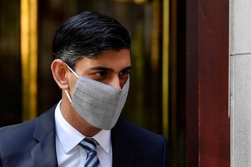 FILE PHOTO: Britain's Chancellor of the Exchequer, Rishi Sunak, leaves a television studio in London, Britain, October 6, 2020. REUTERS/Toby Melville/File Photo