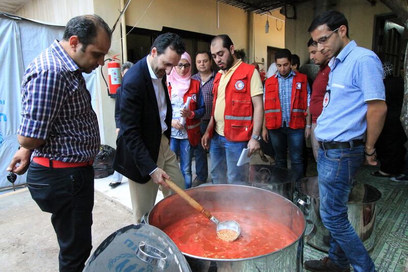 Mr Mardini visits a collective kitchen in Homs, Syria, in 2015