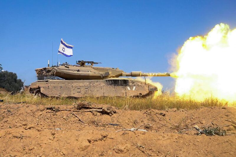 An Israeli tank opens fire in the Gaza Strip. Without an immediate halt to the war, Washington's carefully calibrated moves to reduce volatility in the region could come to naught. AFP