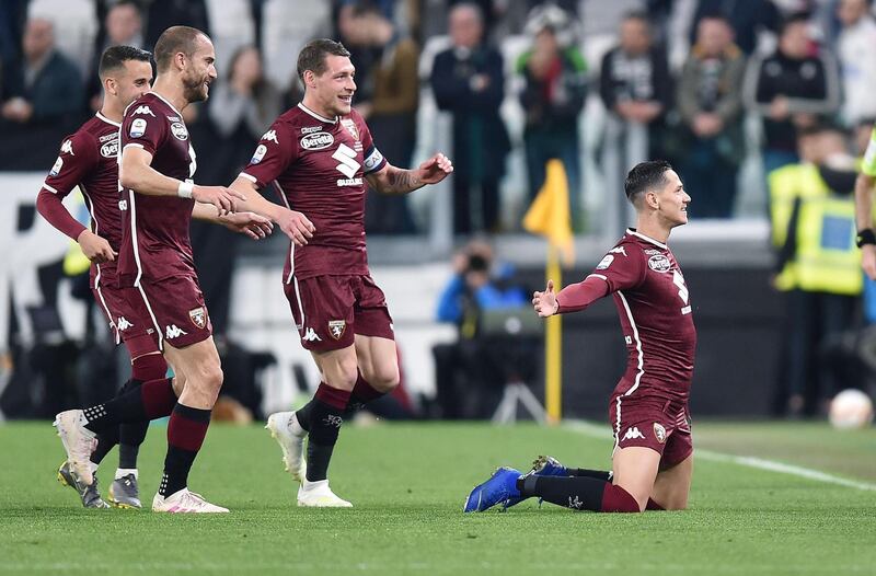 Torino's Sasa Lukic, right, celebrates after giving his side a 17th-minute lead at the Allianz Stadium in Turin. EPA