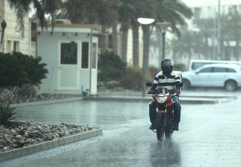 Abu Dhabi, U.A.E., February 2, 2019.   Sudden downpour at Khalifa City, Abu Dhabi.  A delivery motorcycle during a sudden downpour at the Khalifa City area.
Victor Besa/The National
Section:  NA
Reporter: