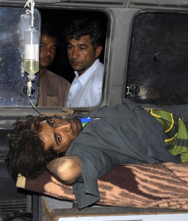 An injured Pakistani earthquake victim lies in an ambulance outside a local hospital in the town of Dalbandin in southwestern Baluchistan province on April 17, 2013. A powerful earthquake struck southeastern Iran on April 16, killing at least 34 people across the border in Pakistan and shaking buildings as far away as the Gulf and New Delhi.     AFP PHOTO / BANARAS KHAN
 *** Local Caption ***  926158-01-08.jpg