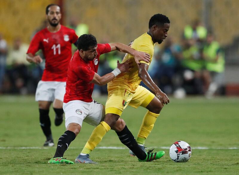 Egypt's Tarek Hamed in action with Guinea's Amadou Diawara. Reuters