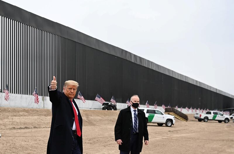 US President Donald Trump gives a thumbs up after touring a section of the border wall in Alamo, Texas on January 12, 2021. (Photo by MANDEL NGAN / AFP)