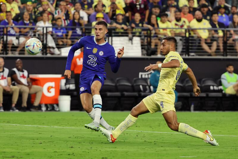 Kai Havertz shoots while under pressure from Sebastian Caceres of Club America. AFP
