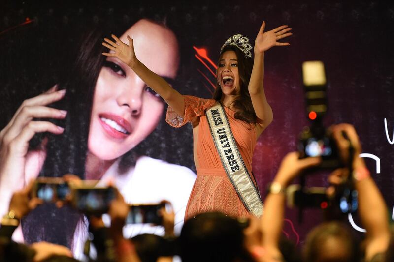 Catriona Gray waves to well-wishers at a press conference in Manila. AFP