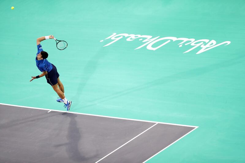 Abu Dhabi, United Arab Emirates - Reporter: Jon Turner: Novak Djokovic serves during the third place play-off between Novak Djokovic v Karen Khachanov at the Mubadala World Tennis Championship. Saturday, December 21st, 2019. Zayed Sports City, Abu Dhabi. Chris Whiteoak / The National