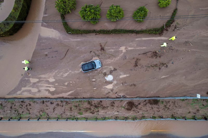 A vehicle trapped by mud and debris at Jameson Lane near the 101 highway in Montecito. AP